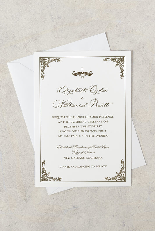 White and gold ornate St. Louis Cathedral New Orleans wedding invitation with ornate gold fleur de lis corners.