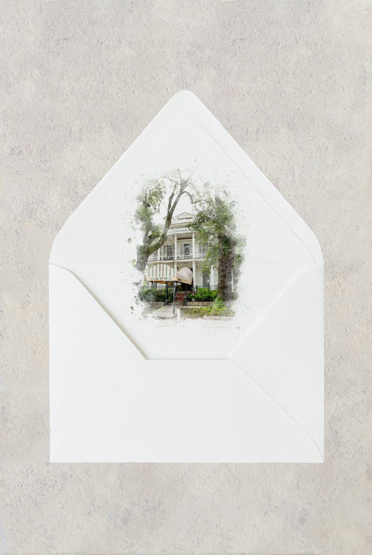 New Orleans wedding envelope liner with a watercolor image of the wedding venue The House of Broel on St. Charles Avenue.