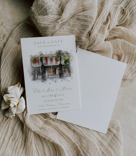 Jackson Square destination wedding save the date invitation with a watercolor image of the Jackson Square gates and a lovely gold script font.