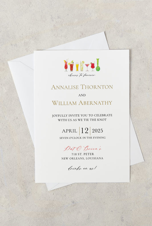 New Orleans Pat O'Brien's destination wedding invitation with Hurricane cocktail glasses and the words "cheers to forever."