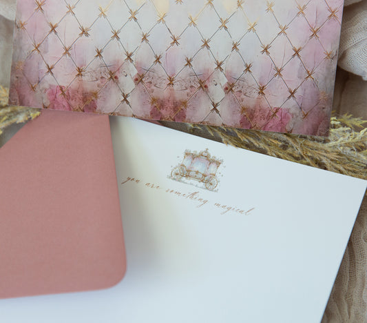 Mauve and sparkly gold fairytale carriage notecard with diamond pattern back. Perfect a princess birthday. Mauve envelopes are included.