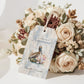 Wedding welcome basket thank you tag with a pastel watercolor background and a watercolor pelican with the words "Welcome to Louisiana" and the couples name and wedding date.