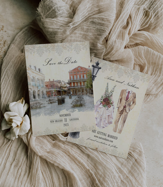 New Orleans save the date with a watercolor image of the pedestrian mall in Jackson Square on the front and a bride's dress, groom suit and black iron lamp post on the back.