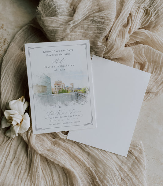Baton Rouge wedding save the date featuring my own watercolor image of The River Terrace at The Shaw Center for the Arts with The Old State Capitol in the background. Wedding details are written in a grey Script/serif font combo.